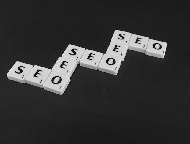 Tiles spelling "SEO" on a black background, emphasizing the importance of search engine optimization in digital strategy.